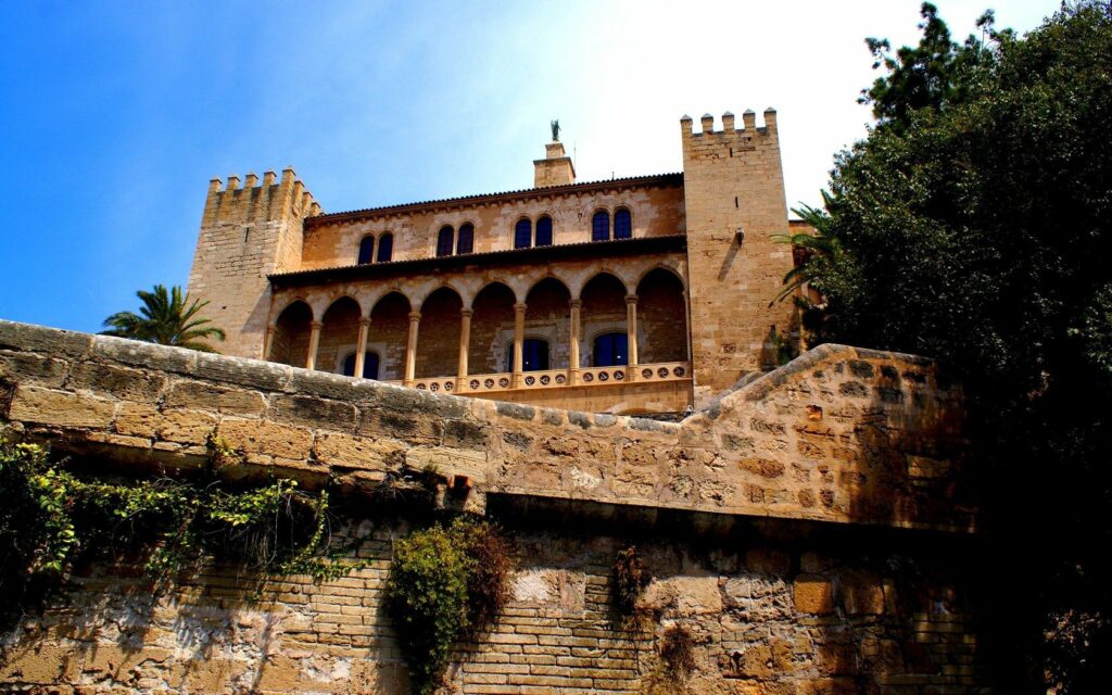 Historic Spanish Castle Wallpaper: Stunning Stone Architecture & Greenery