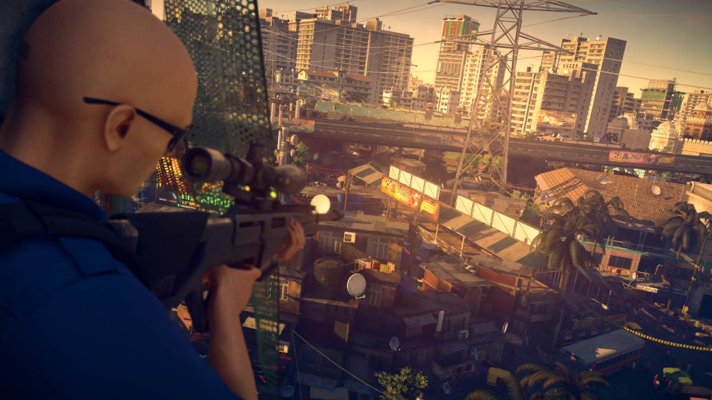 Agent 47 sniper in Hitman 2 Mumbai slums golden hour cityscape 3D stealth game wallpaper