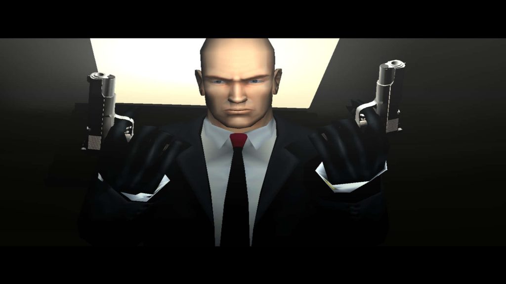 Hitman Agent 47 in black suit dual-wielding silver pistols dark intense gaming wallpaper background