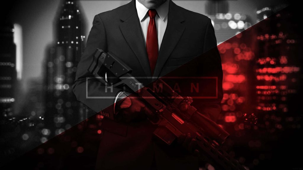Hitman Agent 47 in black suit with tactical rifle against red city skyline digital art wallpaper