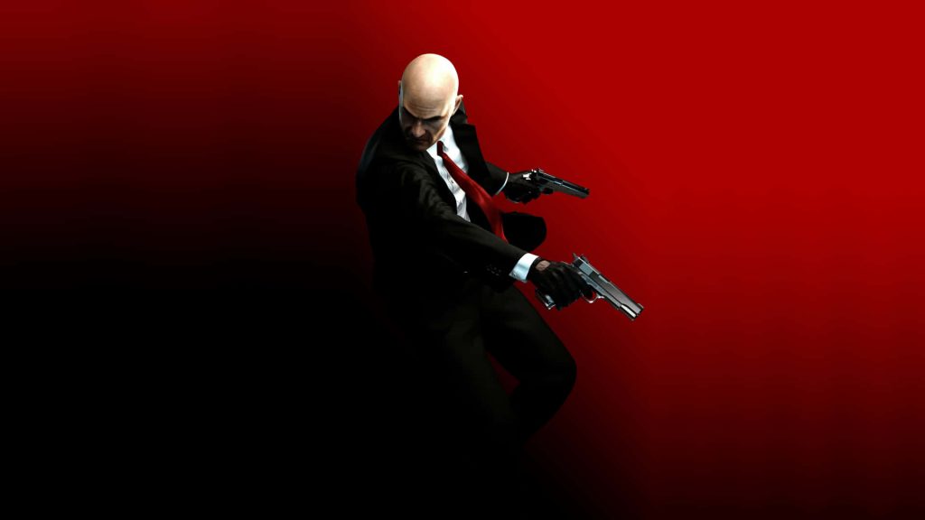 Hitman wallpaper featuring Agent 47 in black suit red tie dual pistols dramatic red black background
