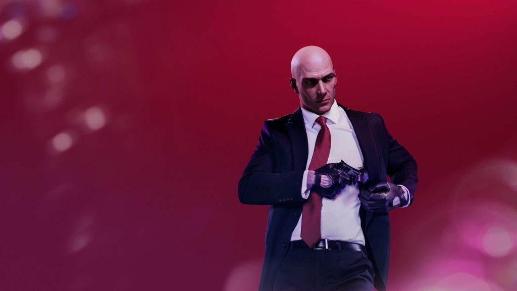 Hitman Agent 47 in black suit and red tie aiming pistol on cinematic crimson background wallpaper