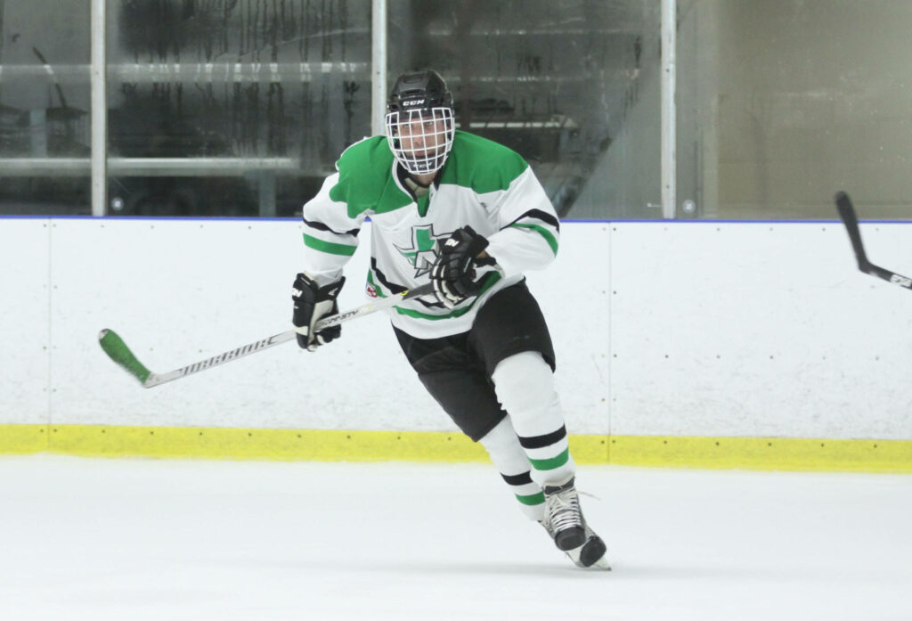 Dynamic Hockey Player Wallpaper: Action on Ice in Green & White