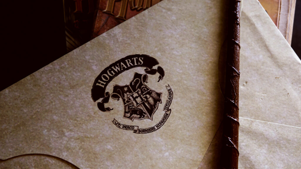 Intricate Hogwarts Acceptance Letter Wallpaper Background for Wizarding Fans