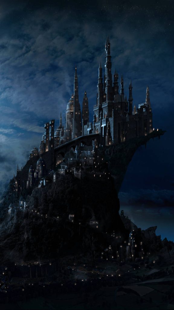Hogwarts Castle illuminated at night on a cliff digital art wallpaper for Harry Potter fans