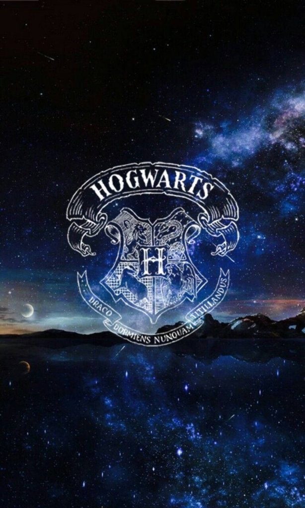 Hogwarts crest wallpaper with cosmic galaxy and reflective waters magical Wizarding World background