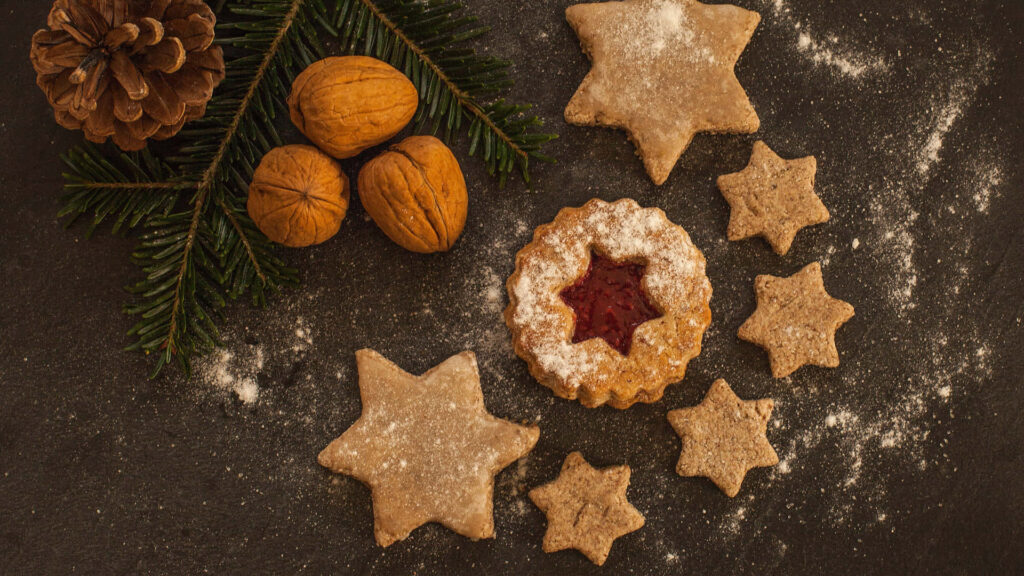 Crafty Conjuring: Tempting Pentagram Shaped Cookies on a Rustic Wooden Table Wallpaper