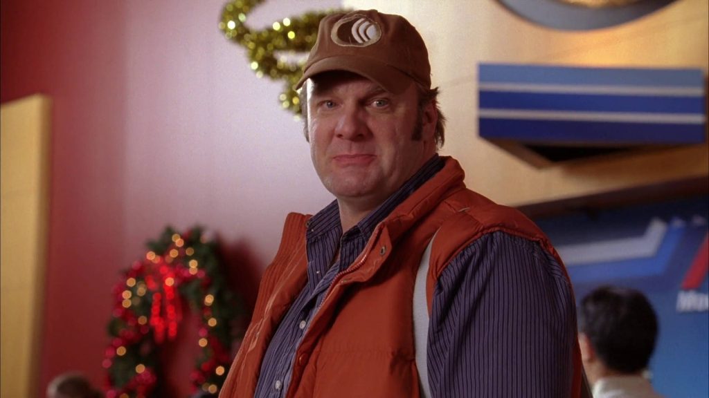 Bob Duncan from Good Luck Charlie in orange vest and cap with Christmas lights wreath background Wallpaper