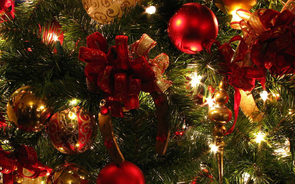 Festive Ornaments Adorned Christmas Tree on Aesthetic Laptop Wallpaper