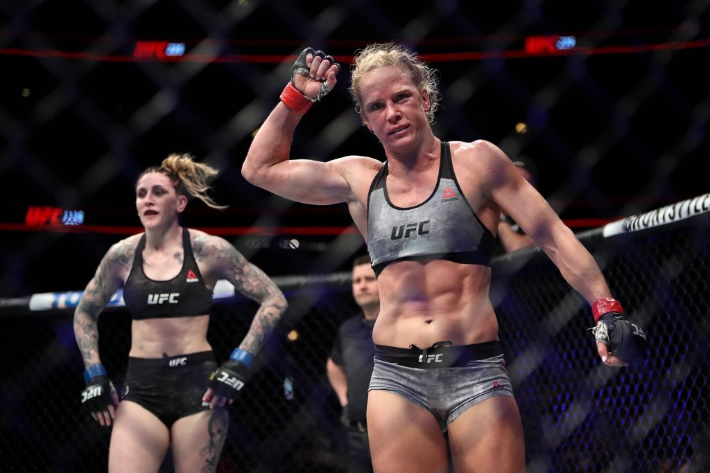 Holly Holm victorious over Megan Anderson UFC 225 intense MMA fight arena wallpaper background