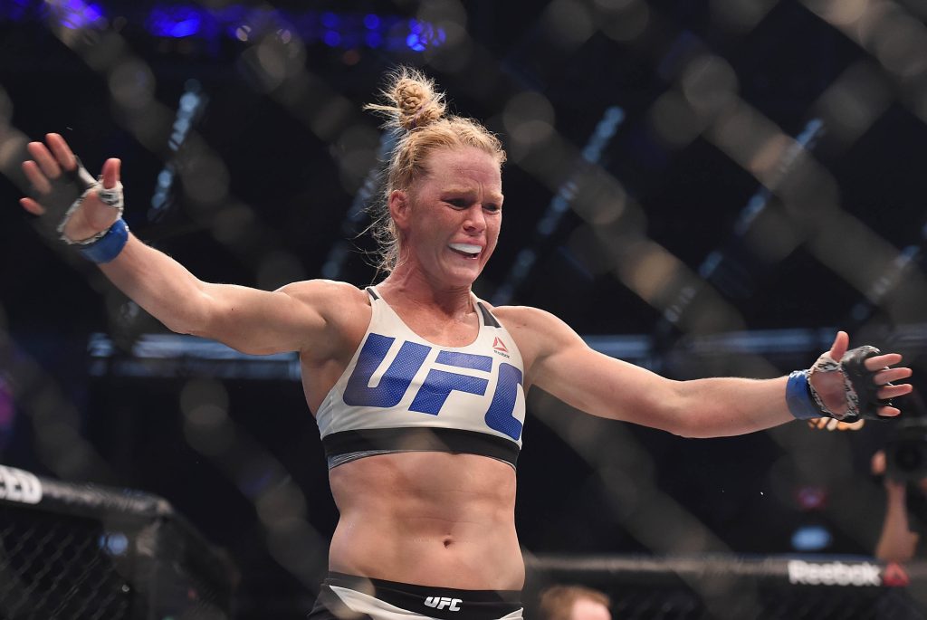 Holly Holm UFC Bantamweight Champion victory inside octagon in Reebok fight gear wallpaper
