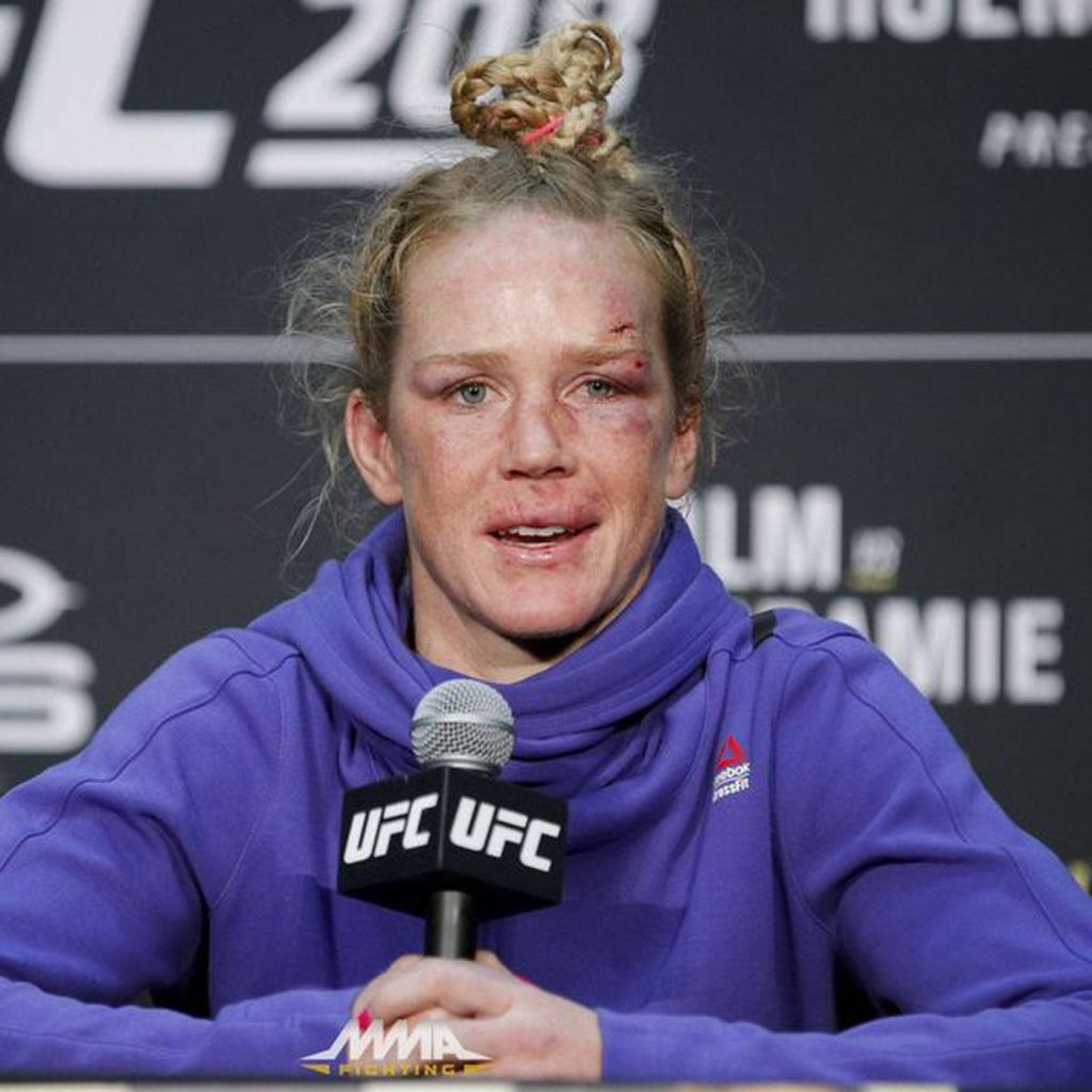 Holly Holm UFC post-fight photo purple hoodie bruised face MMA press conference wallpaper background