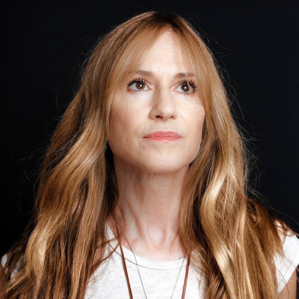 Portrait of actress Holly Hunter with soft light and black background in high-quality wallpaper