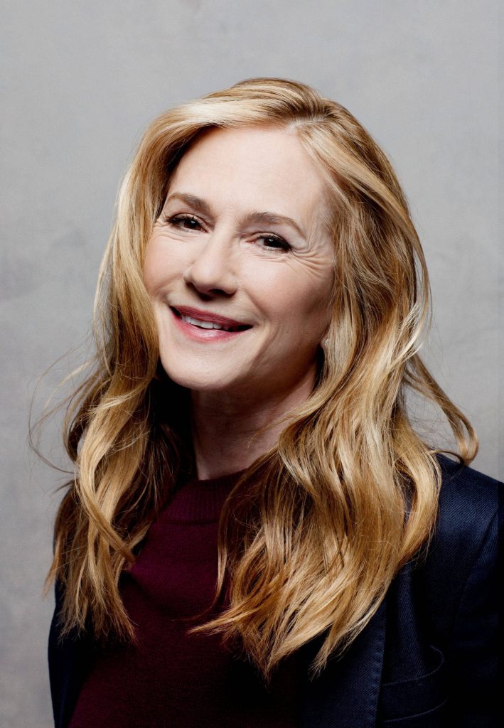 Holly Hunter smiling portrait with long wavy blonde hair on grey background Sundance 2017 Wallpaper