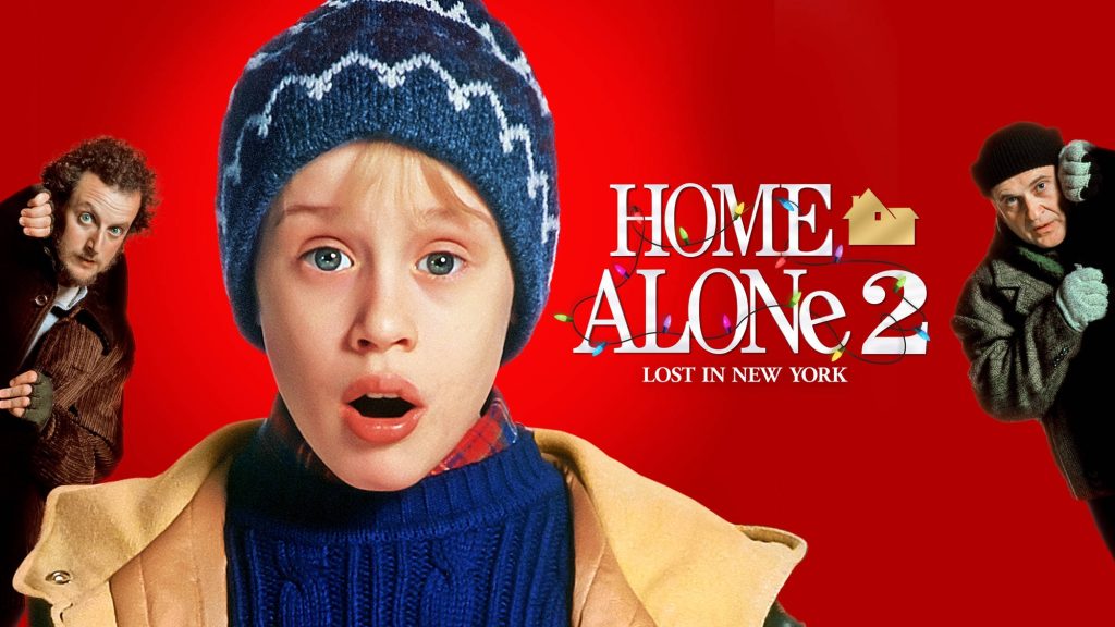 Home Alone 2 wallpaper with shocked Kevin McCallister and Wet Bandits on red background