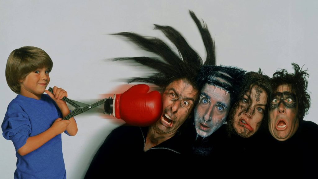 Alex D Linz as Alex Pruitt punches four thieves with red boxing glove Home Alone 3 art Wallpaper
