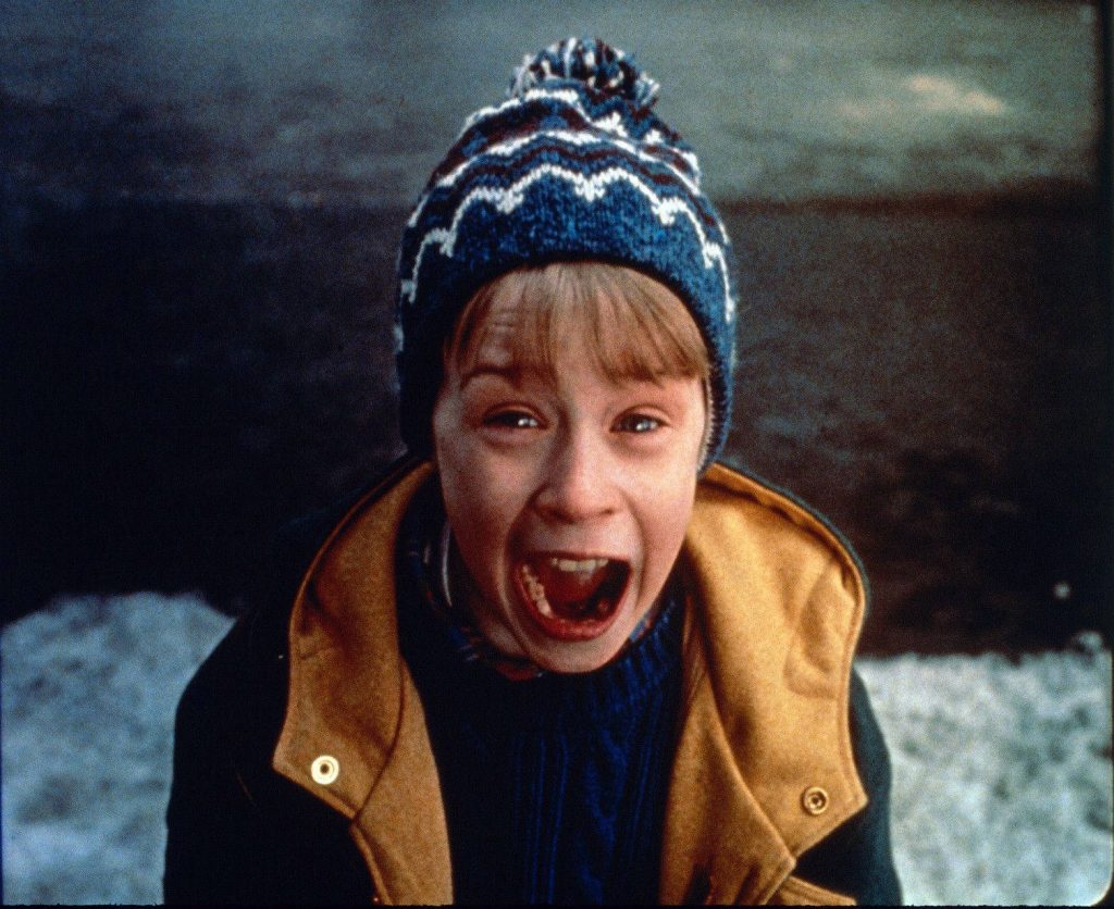 Home Alone Kevin McCallister mid-scream winter beanie tan jacket iconic 1990 movie wallpaper