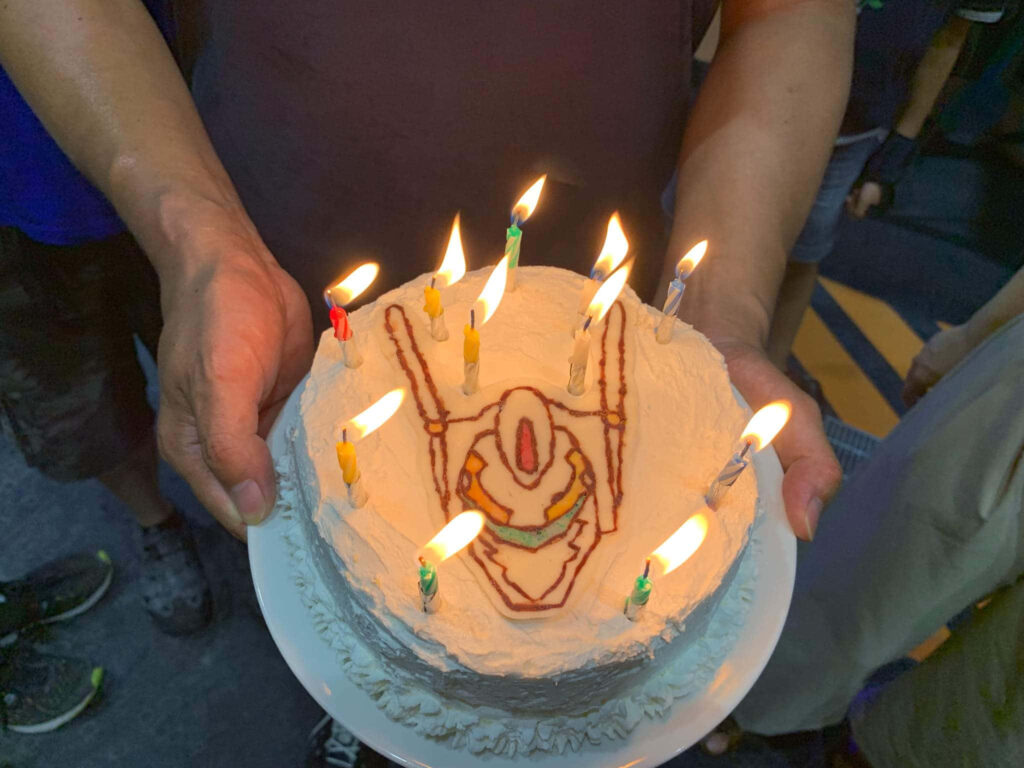 Homemade Cake with Hand-Drawn Robot and Celebratory Candles Wallpaper
