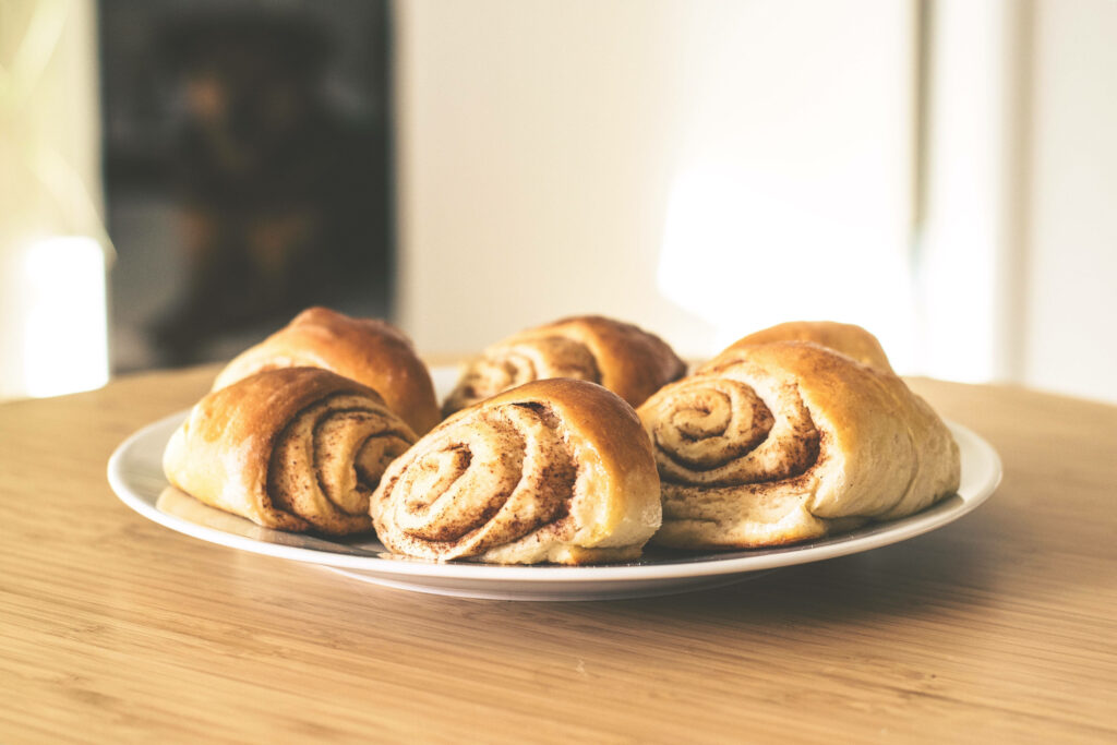 Golden-Brown Homemade Cinnamon Rolls Wallpaper for Your Kitchen