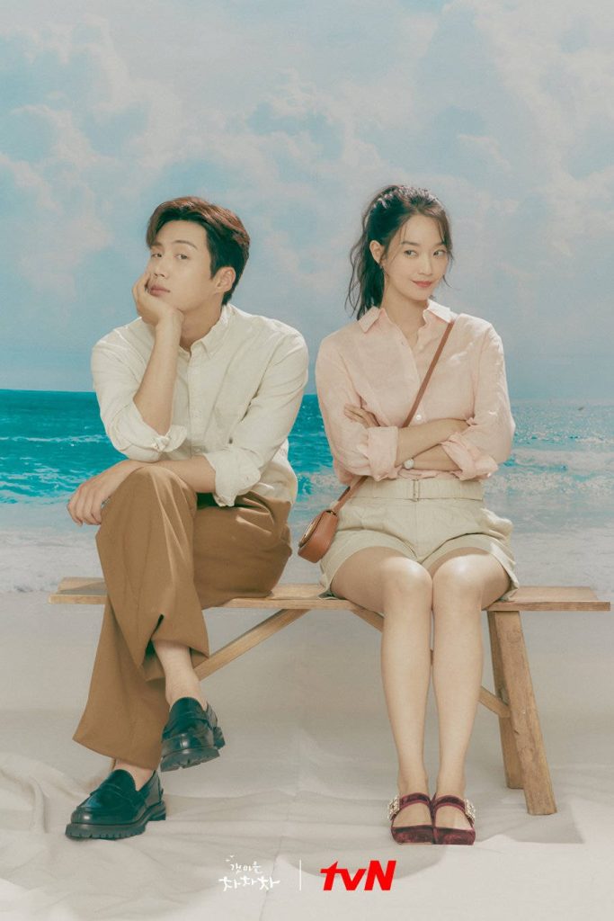 Hometown Cha-Cha-Cha poster with Kim Seon-ho and Shin Min-a on pastel beach bench background Wallpaper