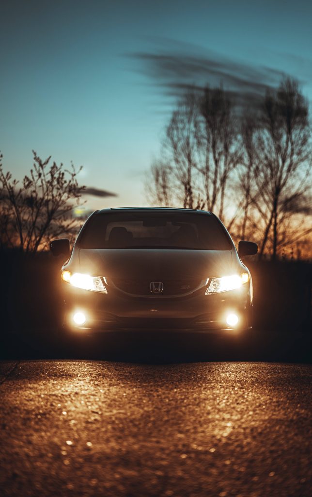 Honda Civic Si at twilight with vibrant headlights and fog lights illuminating the road Wallpaper