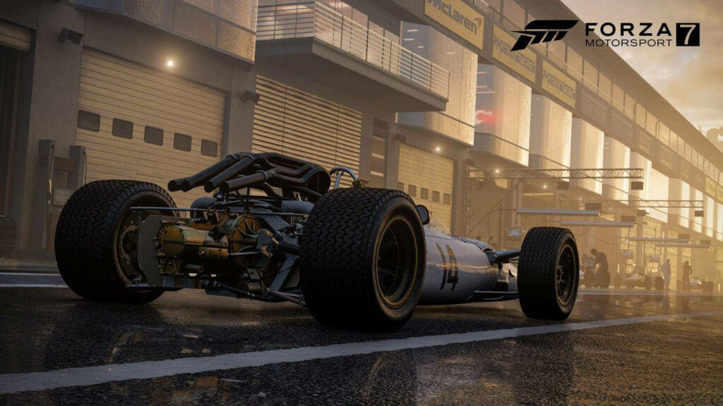 Honda RA300 Wallpaper: Iconic Motorsport Car in Racing Pit Background