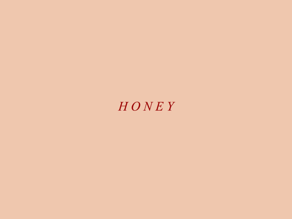 Serene Simplicity: A Captivating Beige Backdrop Elegantly Envelops the Dark Crimson Honey Typography Wallpaper