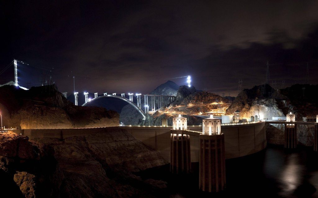 Hoover Dam and Mike O'Callaghan–Pat Tillman Bridge illuminated at night desert wallpaper