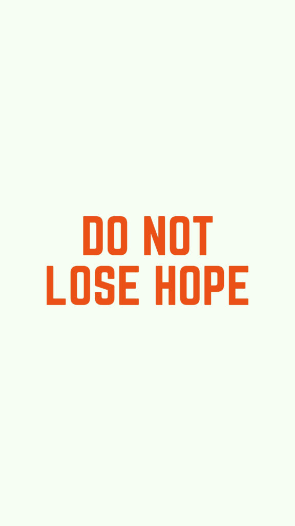 Don't Give Up: Encouraging Motivational Quote on a Clean White Background Wallpaper