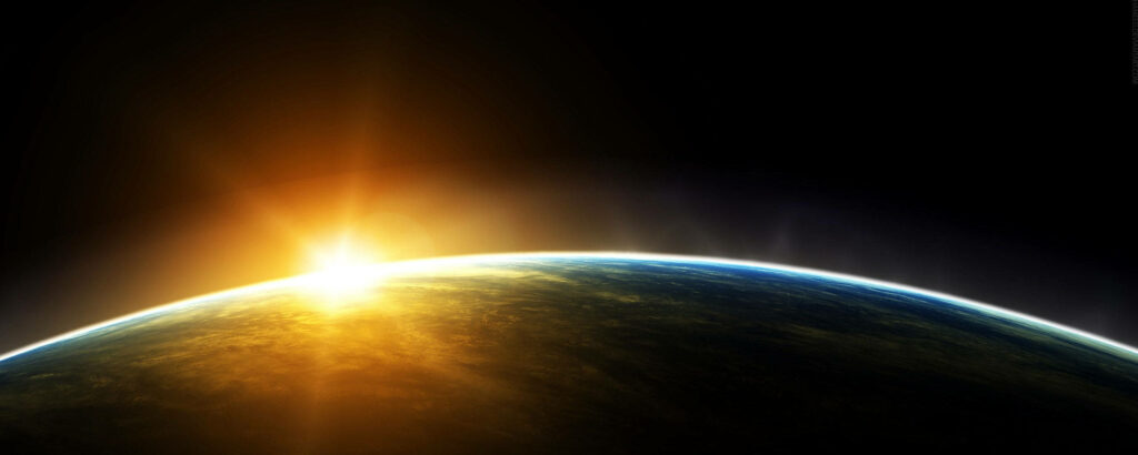 Horizon of Earth: Mesmerizing Widescreen Space Sunrise Wallpaper