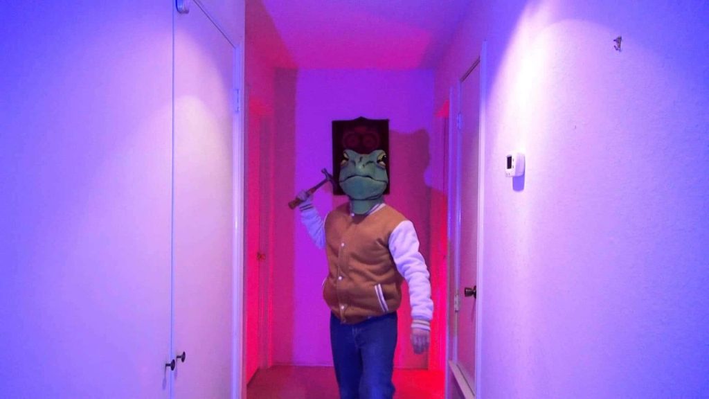 Hotline Miami wallpaper green frog mask hammer neon purple pink hallway cinematic tense atmosphere