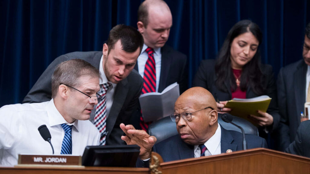 House Oversight Committee hearing with Jim Jordan and Elijah Cummings in intense discussion Wallpaper