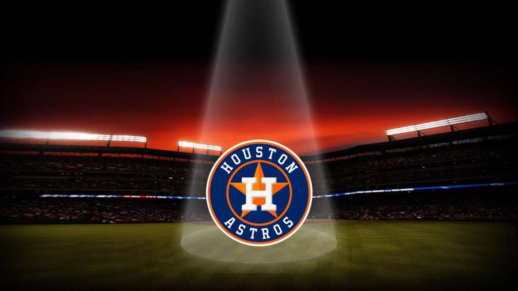Houston Astros logo spotlighted in dark stadium twilight baseball wallpaper background