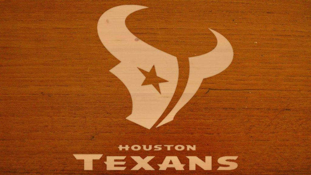 Houston Texans logo and wordmark on rustic warm wood grain background NFL wallpaper