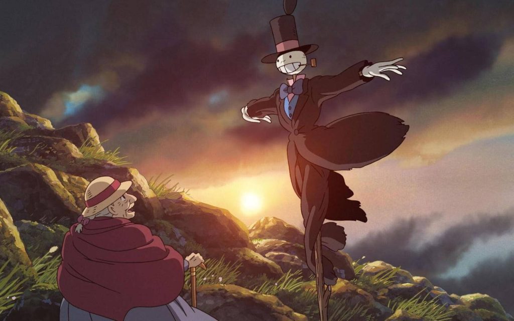 Howls Moving Castle wallpaper with Turnip Head and elderly Sophie at golden sunset hillside