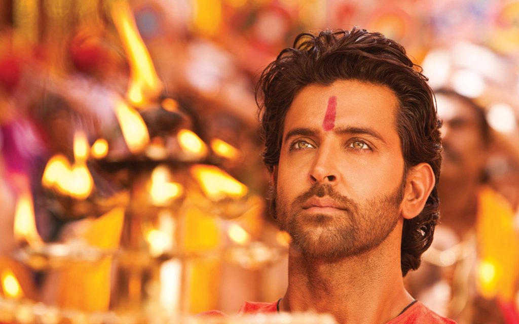 Hrithik Roshan Agneepath wallpaper with red tilak warm golden festival lamp glow HD portrait