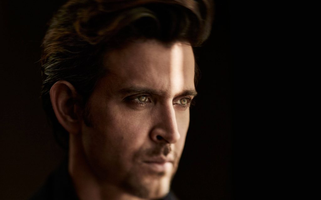 Hrithik Roshan intense portrait with dramatic light streak piercing gaze Bollywood wallpaper