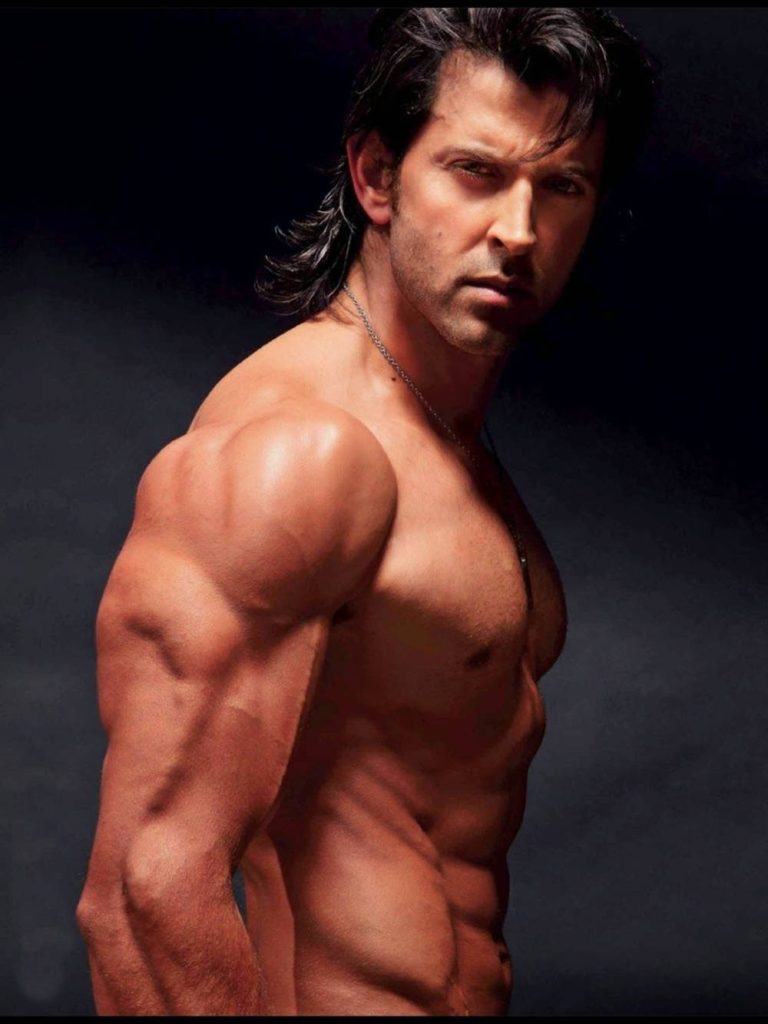 Bollywood star Hrithik Roshan shirtless side profile muscular intense studio portrait wallpaper