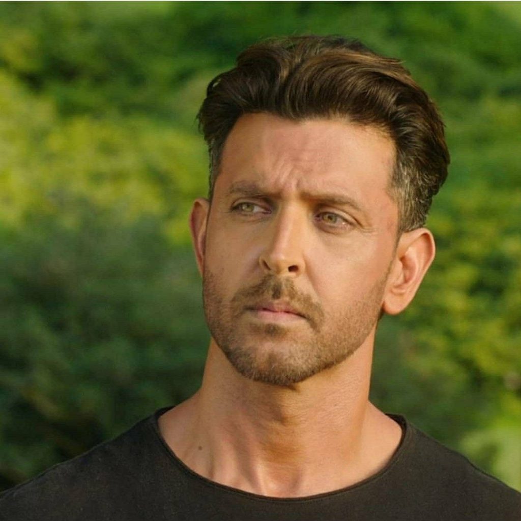 Hrithik Roshan intense gaze black t-shirt cinematic portrait nature background War film wallpaper