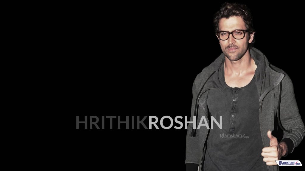 Hrithik Roshan stylish in horn-rimmed glasses dark grey outfit black background wallpaper