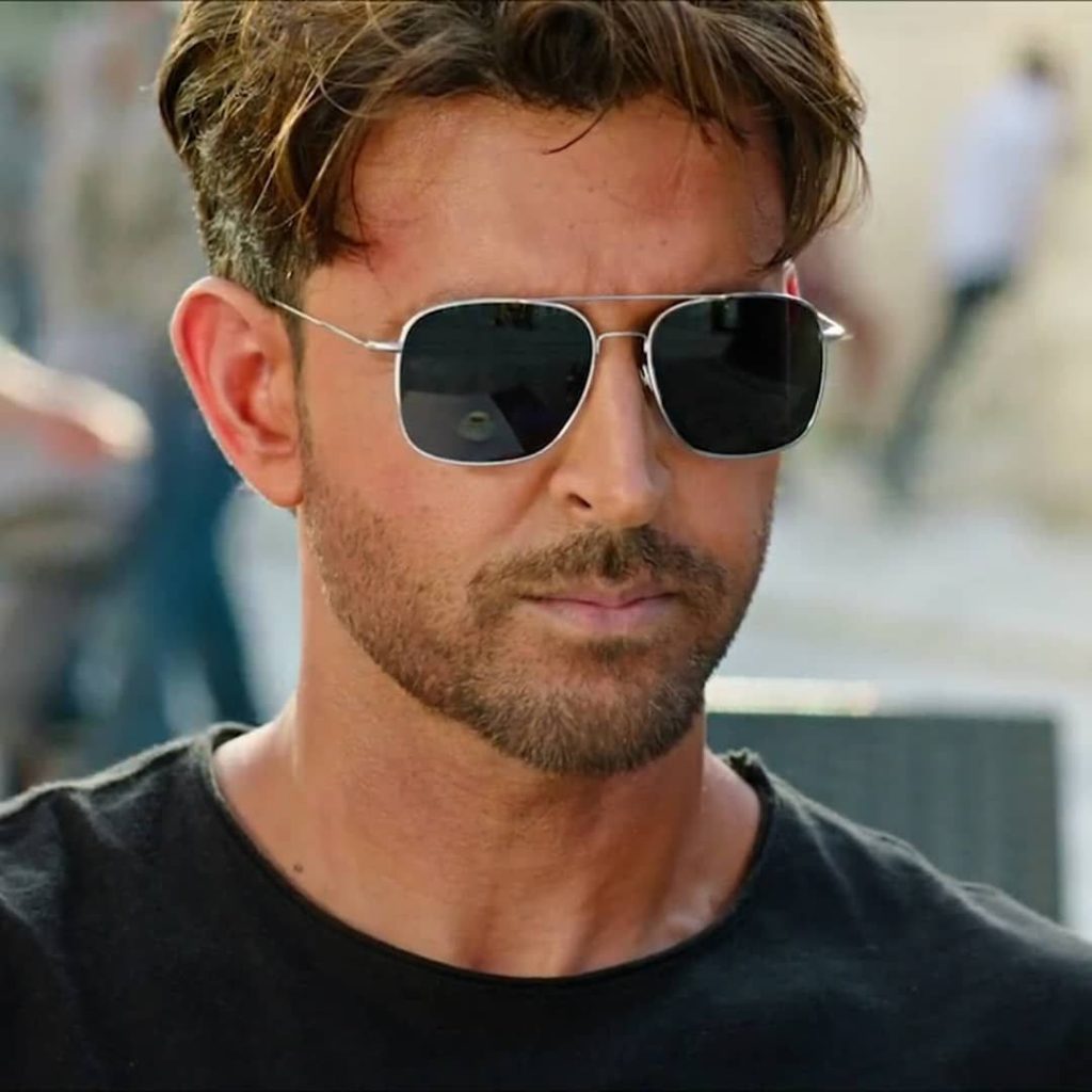 Close-up of Bollywood star Hrithik Roshan in War movie wearing silver sunglasses black t-shirt wallpaper