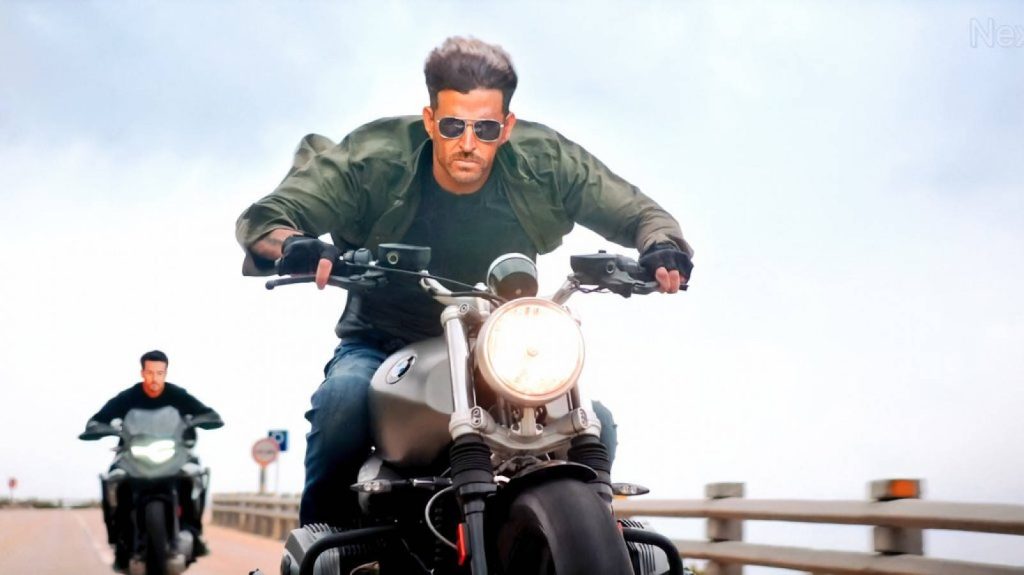 Hrithik Roshan War movie motorcycle chase wallpaper intense Bollywood action scene background