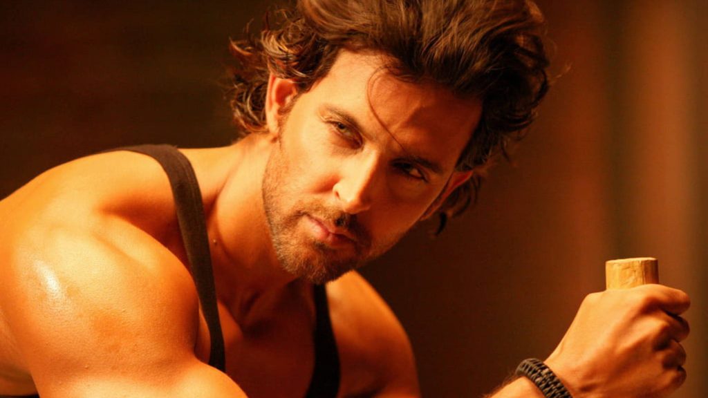 Hrithik Roshan War movie still warm golden light muscular rugged look intense gaze wallpaper