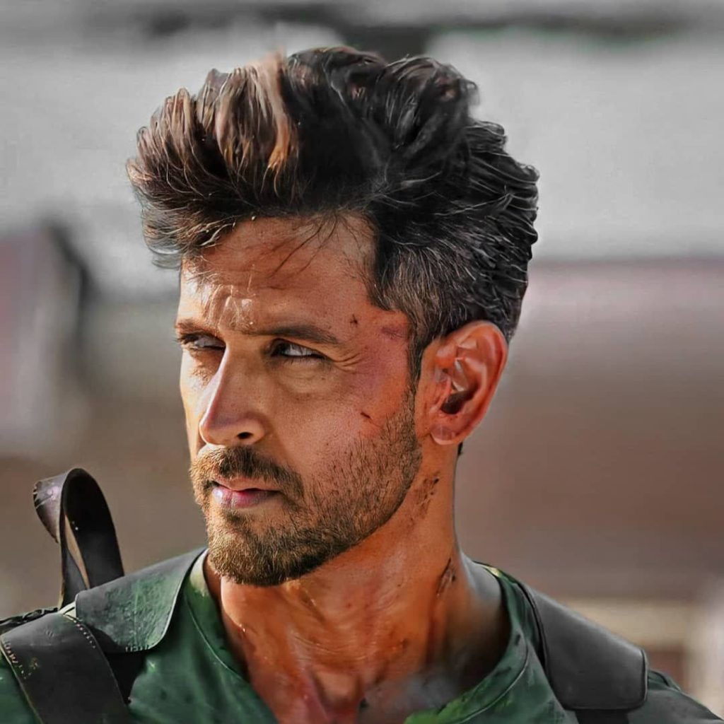 Hrithik Roshan rugged war film portrait with tactical gear and intense wounded look wallpaper background