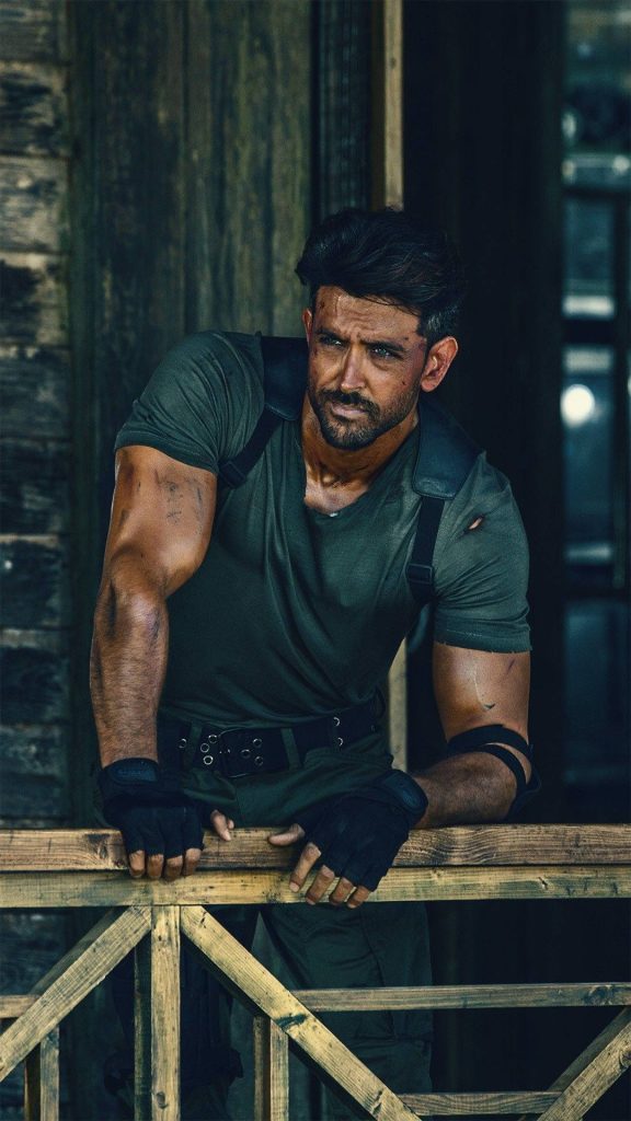 Hrithik Roshan as Kabir in olive tactical gear leaning on wooden railing War movie wallpaper