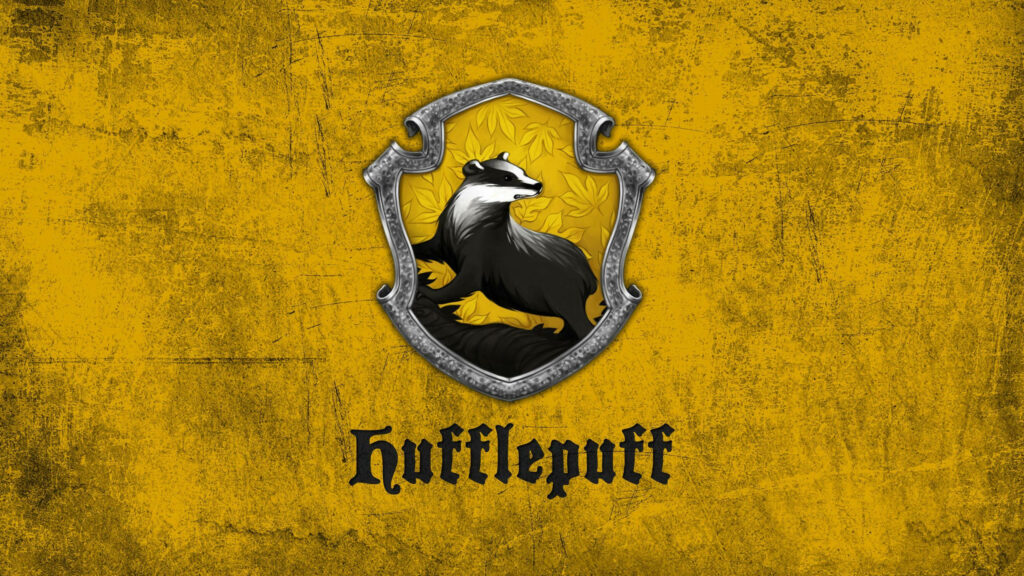 Hufflepuff badger emblem on textured yellow background Harry Potter laptop wallpaper design