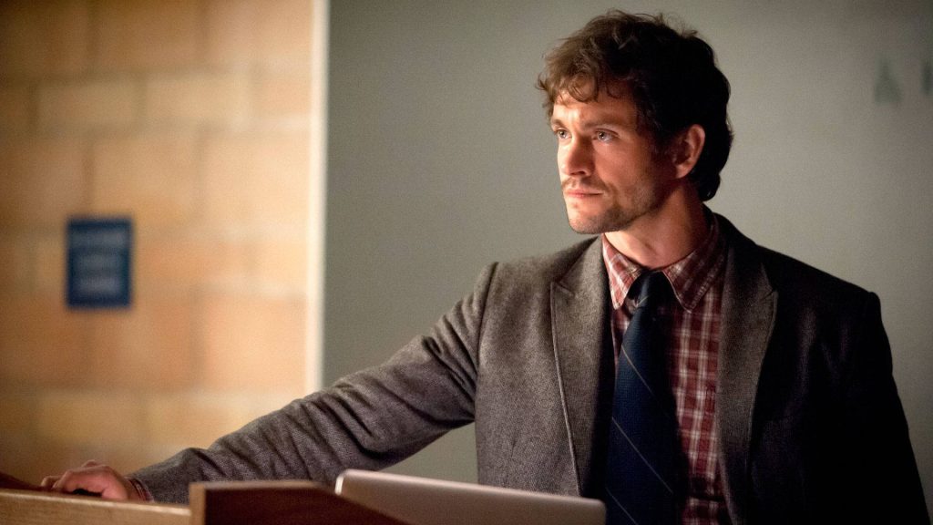 Hugh Dancy as Will Graham in plaid shirt and blazer speaking at podium Hannibal wallpaper
