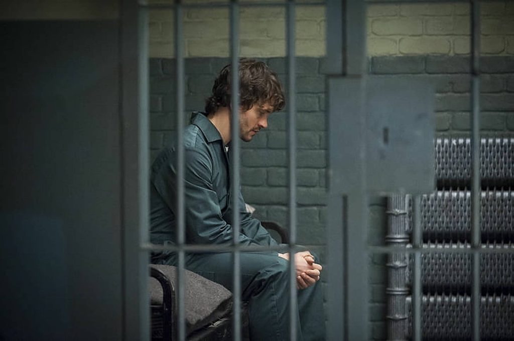 Hugh Dancy as Will Graham in dark prison cell moody lighting Hannibal TV show wallpaper background