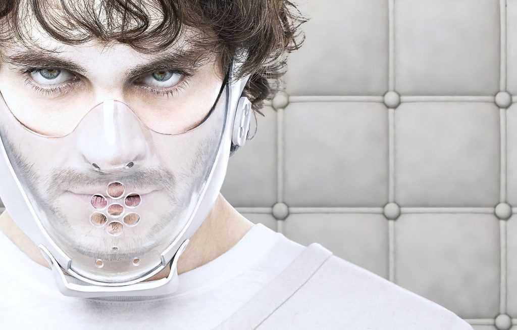 Hugh Dancy as Will Graham in Hannibal season 2 wearing psychiatric restraint mask in padded cell Wallpaper