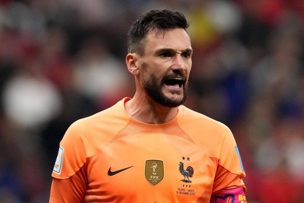 Hugo Lloris yelling in vibrant orange kit 2022 World Cup semi-final football wallpaper background